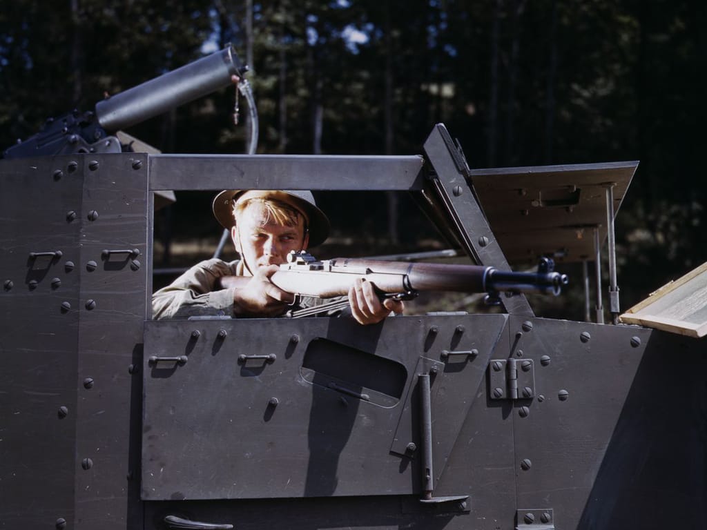 Life at Fort Knox in 1942 - 8. An infantryman takes aim with his M1 Garand rifle