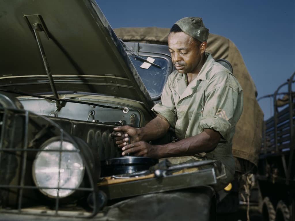 Life at Fort Knox in 1942 - 15. A mechanic tweaks a troop transport vehicle