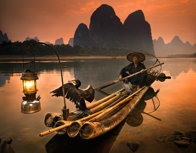 Cormorant Fisherman on the Li River, China by Michael Anderson