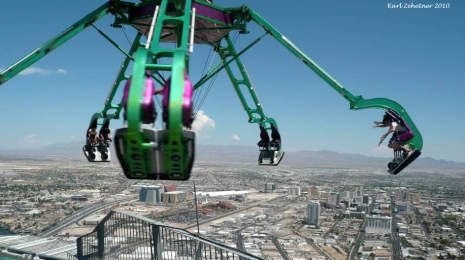 Insanity at the Stratosphere Hotel in Las Vegas, USA Insanity is a ride that spins you at speeds of up to three G's. It also hangs 64 feet from the side of the Stratosphere Hotel and 900 feet above the ground.