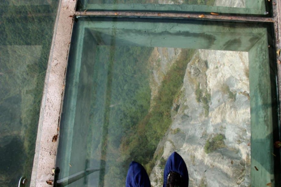 24 of the most creepy places on the planet to look down (56 HQ Photos) The Walk of Faith is a glass walkway built on the side of the 4700 foot tall Zhangjiajie Tianmen. You arrive by cable car, and as long as you don’t suffer from vertigo, the leisurely stroll is an unforgettable experience.